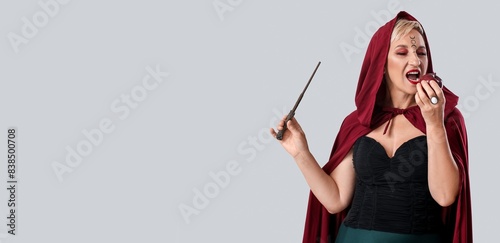 Mature witch with magic wan...