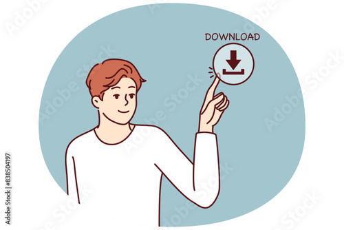 Young man presses download button on screen for concept of web content consumption and network use. Guy downloads information from Internet using cloud storage or torrent clients with media files