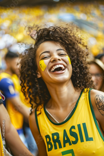 Brazilian football soccer fans in a stadium supporting the national team, Seleção
 photo