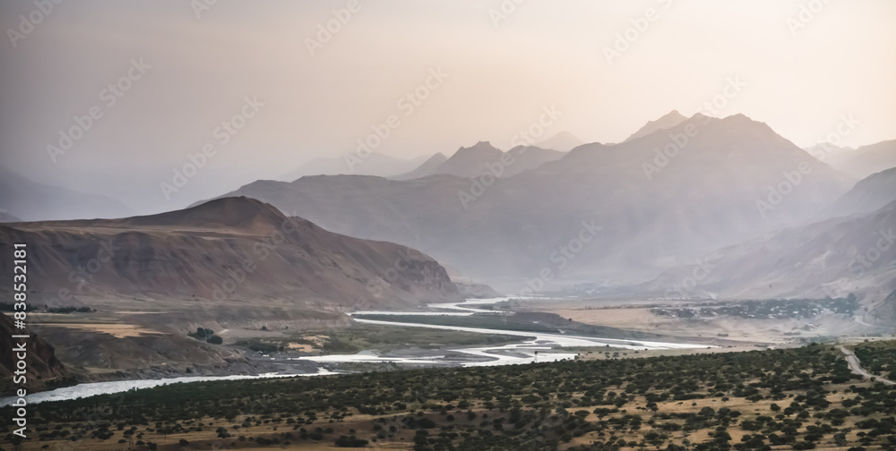 Panoramic mountain landscape in the mountains in the evening at sunset for background in the mountains of Tajikistan, the texture of hills and high mountains minimalist in the evening Panoramic mountain landscape in the mountains in the evening at sunset for background in the mountains of Tajikistan, the texture of hills and high mountains minimalist in the evening