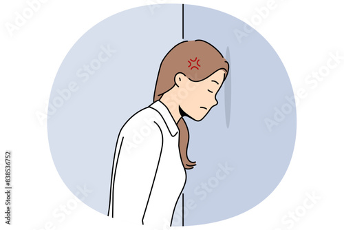 Woman bangs head against wall because of mental problems or failures in personal life. Girl stands with eyes closed, inventing way to solve problems that have arisen and in need of moral support.