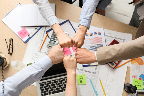 Business people bumping fis...