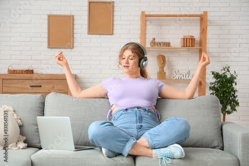 Young woman in headphones w...
