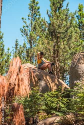 Woman sitting in nature taking a photo