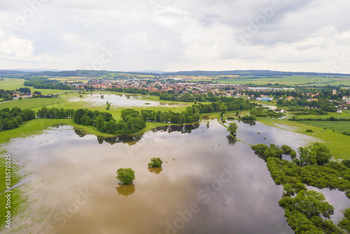 Flood in the countryside near the town Dobrany, West Bohemia, Czech republic, European union. Aerial view of flooded Radbuza river and landscape.