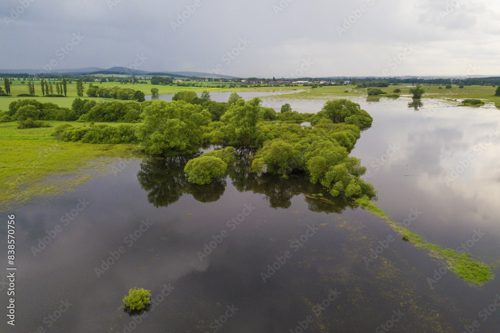 Flood in the countryside near the town Dobrany, West Bohemia, Czech republic, European union. Aerial view of flooded Radbuza river and landscape.