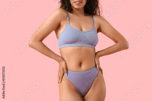 Beautiful young African-American woman in stylish underwear on pink background, closeup