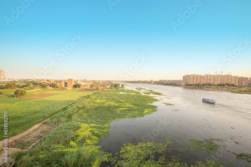 Nile River View, Cairo, Egypt, Buildings on the Right Bank and Green Fields on the Left Bank, Boat Sailing