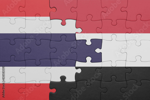 puzzle with the colourful national flag of thailand and flag of yemen .