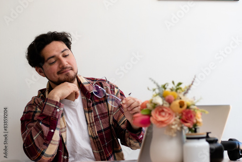 Young man using Glasses for firts time and get emotion gestures front his laptop in the living room