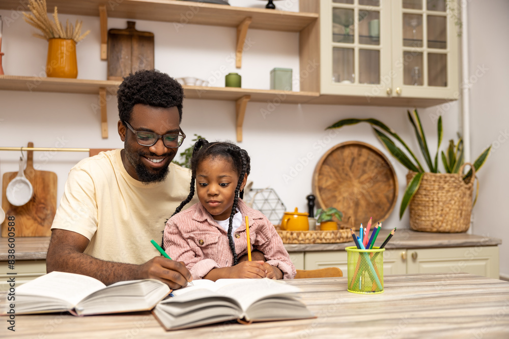 Young dad explaining kid daughter learning doing homework Young dad explaining kid daughter learning doing homework
