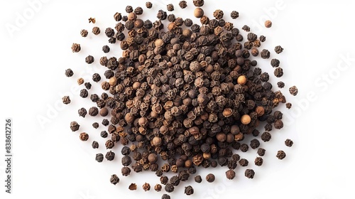 pile of ground black peppercorns isolated on white background top view photo