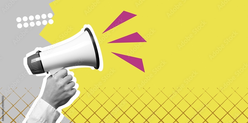 Hand hold megaphone scream on colored background