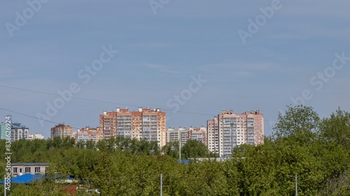 Photography A city skyline with tall buildings and a blue sky