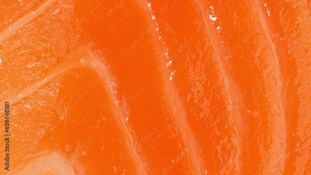 Luxurious sashimi: Premium salmon slices, radiant with deep orange hues and delicate marbling. Each piece offers a moist, glossy texture, ensuring a divine melt-in-the-mouth sensation.
