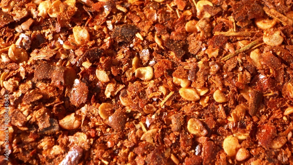 Up close, ground chili teases the eye with its fiery palette, a blend of passionate reds and robust browns. Its texture, a medley of flakes and seeds, promises a tantalizing, spicy experience.
Up close, ground chili teases the eye with its fiery palette, a blend of passionate reds and robust browns. Its texture, a medley of flakes and seeds, promises a tantalizing, spicy experience.