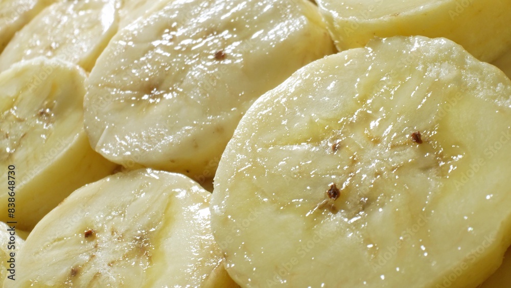 Envision a close-up of sliced bananas, each segment a testament to ripeness with its creamy texture and scattered brown spots. Freshness emanates from the smooth, glossy surface, enticing indulgence.
Envision a close-up of sliced bananas, each segment a testament to ripeness with its creamy texture and scattered brown spots. Freshness emanates from the smooth, glossy surface, enticing indulgence.