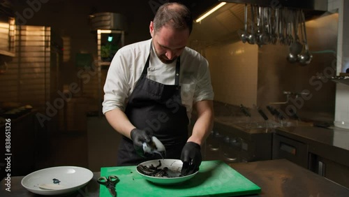 Italian Chef Is Cleaning A Cuttlefish To Obtain Black Ink Juice