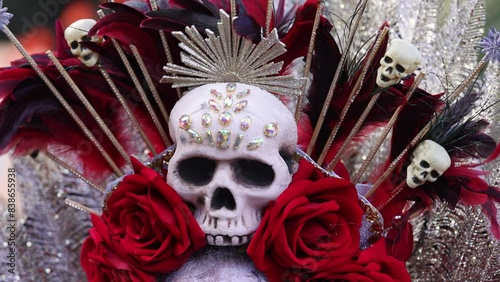 Detail of headpiece worn for the celebration of Dia de Los Muertos with flowers and sugar skulls