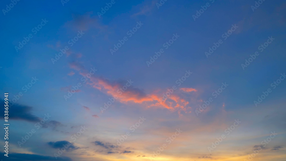 A tranquil sunset with a vibrant sky transitioning from blue to orange and pink hues. Wispy clouds are highlighted with shades of pink and orange, creating a picturesque evening scene.
A tranquil sunset with a vibrant sky transitioning from blue to orange and pink hues. Wispy clouds are highlighted with shades of pink and orange, creating a picturesque evening scene.