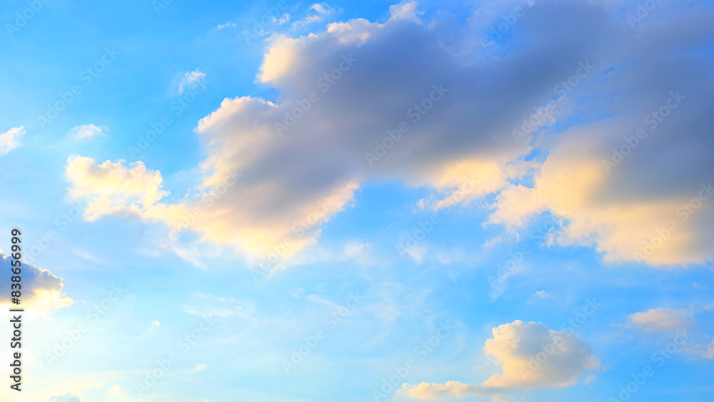 A bright blue sky adorned with scattered clouds. The clouds appear fluffy and are illuminated with a soft golden hue, likely from the setting or rising sun, creating a peaceful and beautiful scene.
A bright blue sky adorned with scattered clouds. The clouds appear fluffy and are illuminated with a soft golden hue, likely from the setting or rising sun, creating a peaceful and beautiful scene.