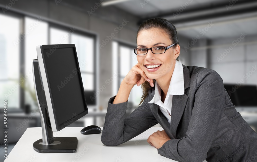 European young business woman using laptop in office European young business woman using laptop in office
