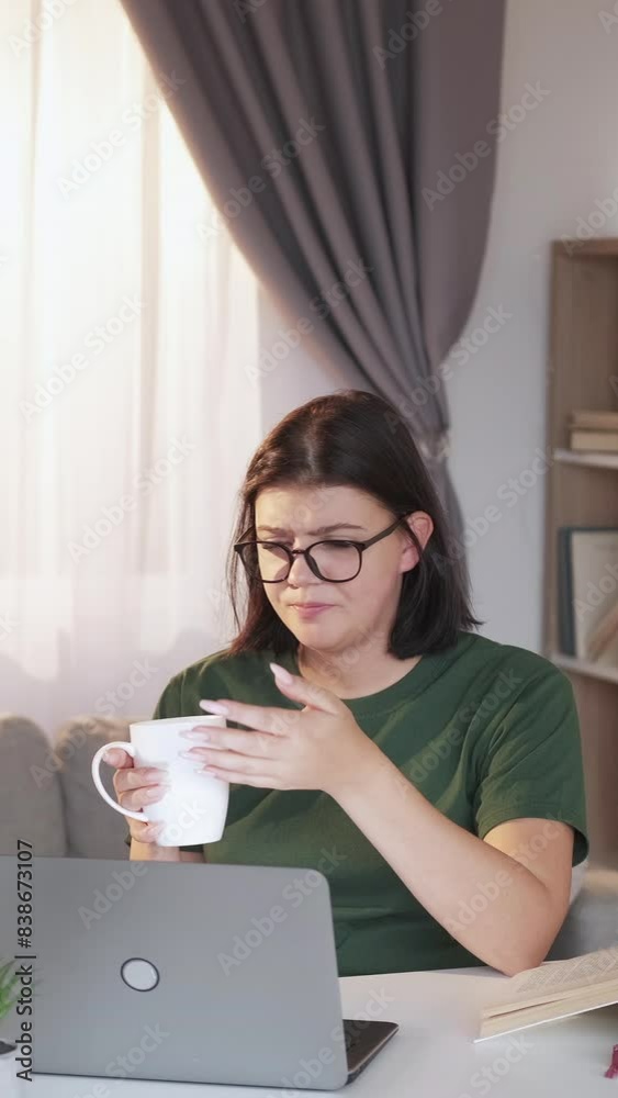 Vertical video. Virtual chat. Internet communication. Tired unhappy woman complaining to friend talking laptop online light home interior. Vertical video. Virtual chat. Internet communication. Tired unhappy woman complaining to friend talking laptop online light home interior.