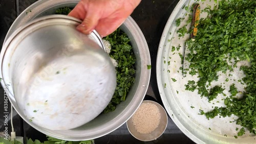 cooking food at home traditional vegetable recipe persian turkish cuisine chopped vegetables steamed rice in metal pot in the kitchen of stove mixture prepare to cook in rural village iran countryside photo