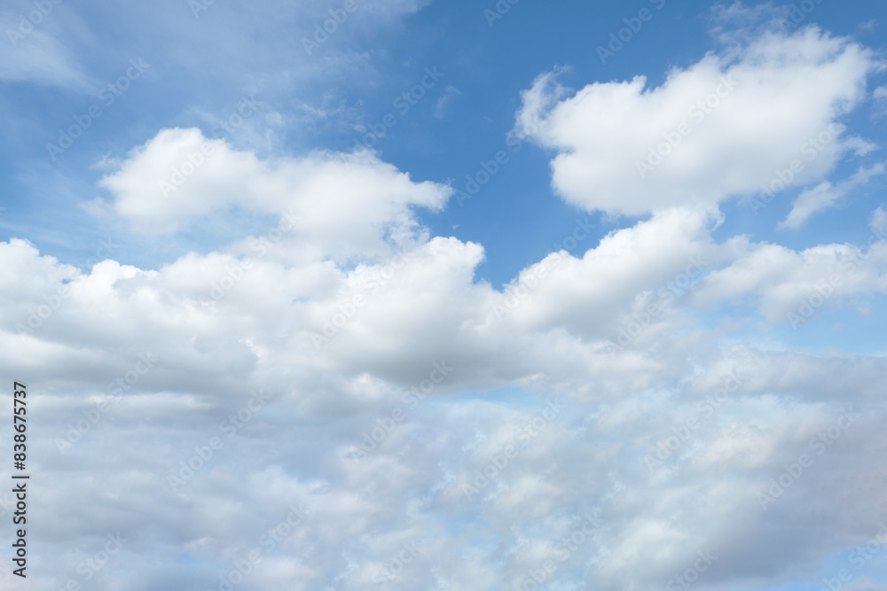 Cloudy blue sky with white cloud in daytime, space for text on background, horizon skyline view. Cloudy blue sky with white cloud in daytime, space for text on background, horizon skyline view.