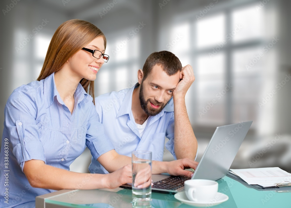 Happy man and woman relax with computer at home Happy man and woman relax with computer at home