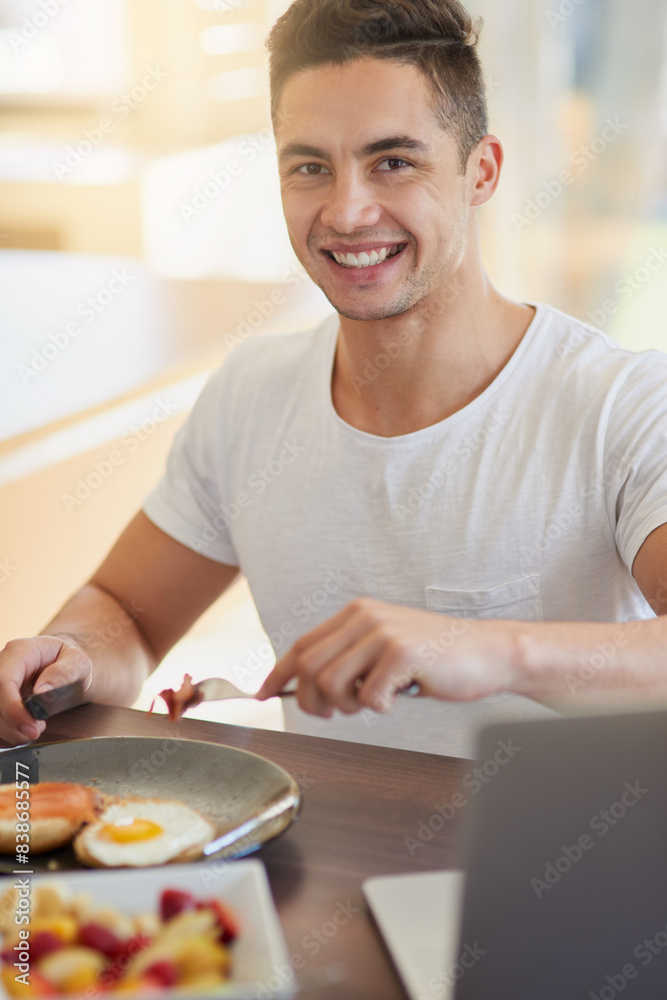 Man, portrait and eating breakfast in house with cutting bacon, healthy meal and nutrition in dining room. Person, wellness and happy nutritionist with organic brunch for detox, vegan diet and relax Man, portrait and eating breakfast in house with cutting bacon, healthy meal and nutrition in dining room. Person, wellness and happy nutritionist with organic brunch for detox, vegan diet and relax