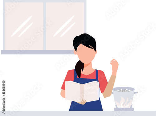 The girl is reading the recipe book.