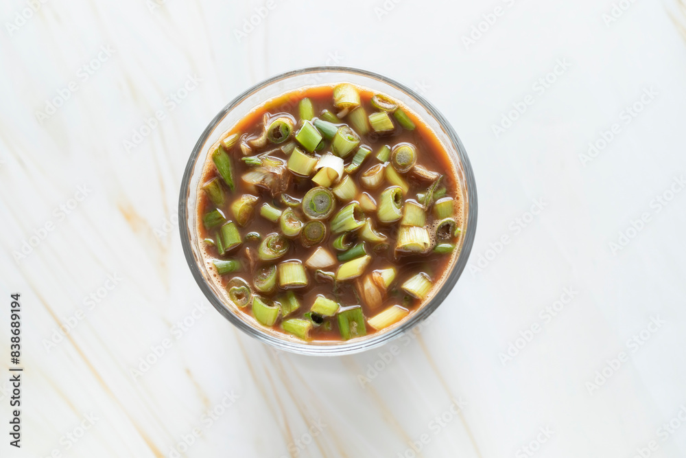 Spring Onion Coffee Or Scallion Coffee, Popular Beverage In China. Top View Glass Of Drink, Cappuccino Or Latte With Onions On Granite Table. Horizontal Plane. Spring Onion Coffee Or Scallion Coffee, Popular Beverage In China. Top View Glass Of Drink, Cappuccino Or Latte With Onions On Granite Table. Horizontal Plane.