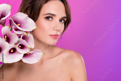 Photo of shiny cute lady nude shoulders enjoy calla bunch aroma empty space isolated neon pink color background