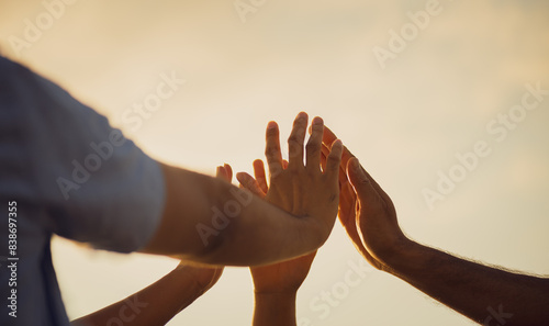Close up people putting their hands together. Friends hands showing unity and teamwork, friendship, happiness and partnership team concept. photo