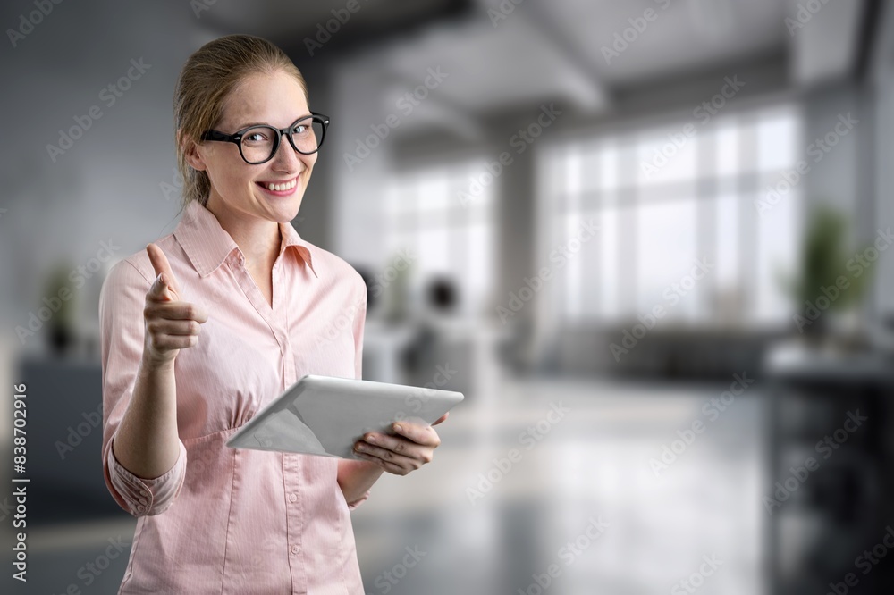 professional businesswoman using digital tablet at workplace
