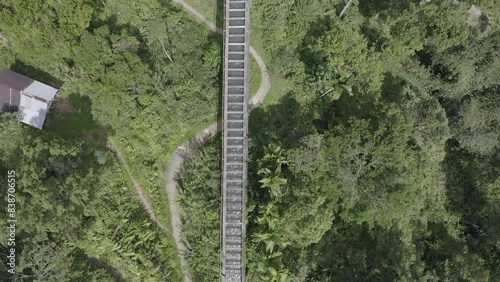 Establish aerial view of the Batu Busuk Hydroelectric Power Plant is one of the villages in Padang City surrounded by forests and rivers d-log raw stock video photo