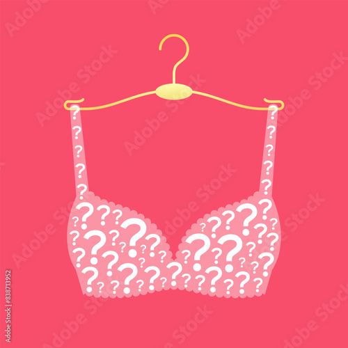 Brassiere made from question mark symbols on clothes hanger