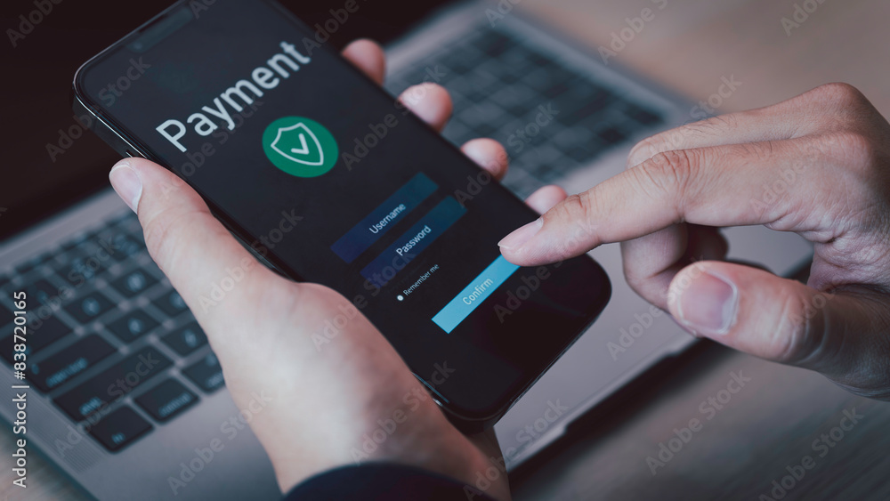 Buy now pay later online shopping concept. Hands holding mobile phone on blurred store as background. Online shopping. Paying after delivery. Complete the payment after purchase at no added cost.