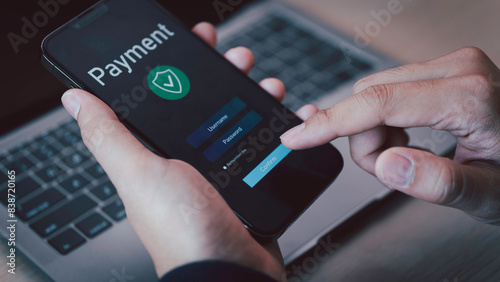 Obraz na płótnie Buy now pay later online shopping concept. Hands holding mobile phone on blurred store as background. Online shopping. Paying after delivery. Complete the payment after purchase at no added cost. w salonie