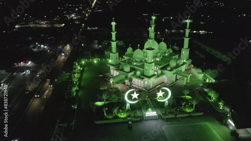 Establish aerial view of the Baiturrahmah Mosque at night in the city of Padang, West Sumatra. d-log raw stock video photo