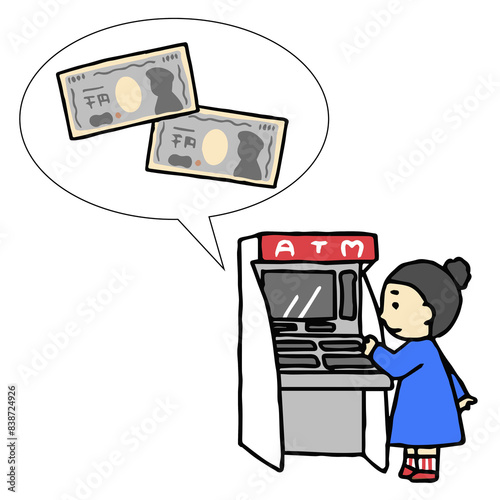 ATMでお金を引き出す人