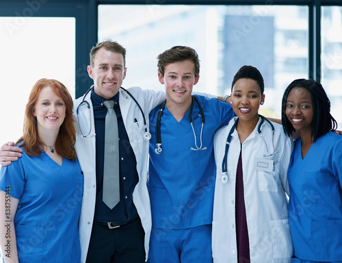 Group, portrait or doctors with smile for medical, hospital staff for wellness or trust. Team, people or together in clinic with happiness for career in healthcare, medicine and diversity in New York