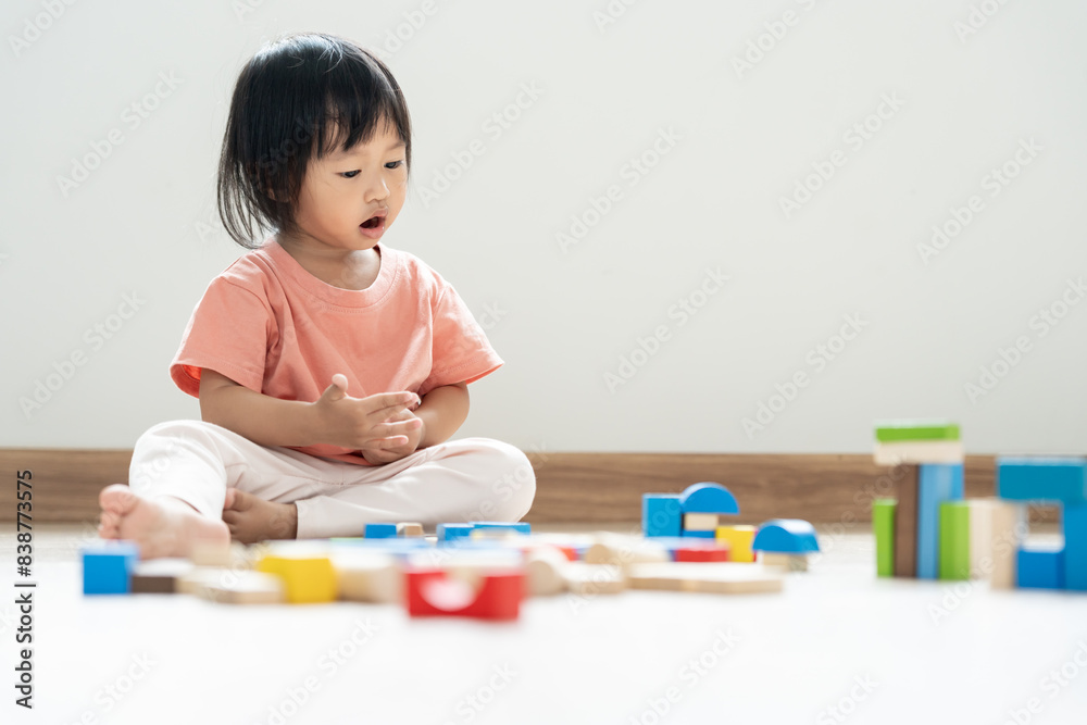 Happy Asian child playing and learning toy blocks. children are very happy and excited at home. child have a great time playing, activities, development, attention deficit hyperactivity disorder Happy Asian child playing and learning toy blocks. children are very happy and excited at home. child have a great time playing, activities, development, attention deficit hyperactivity disorder