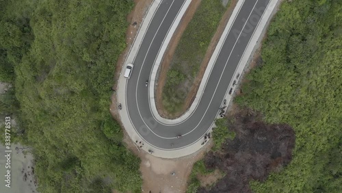 Establish aerial view of beautiful winding roads at Puncak Mandeh, South Coast Regency, West Sumatra. d-log raw stock video photo