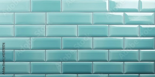 subway tile textured wall with blue and green tiles, including square and blue tiles, set against a blue wall photo