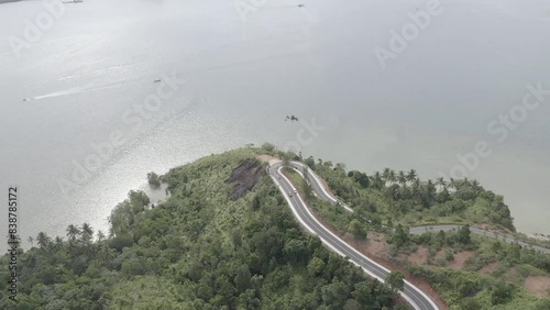 Establish aerial view of beautiful winding roads at Puncak Mandeh, South Coast Regency, West Sumatra. d-log raw stock video photo