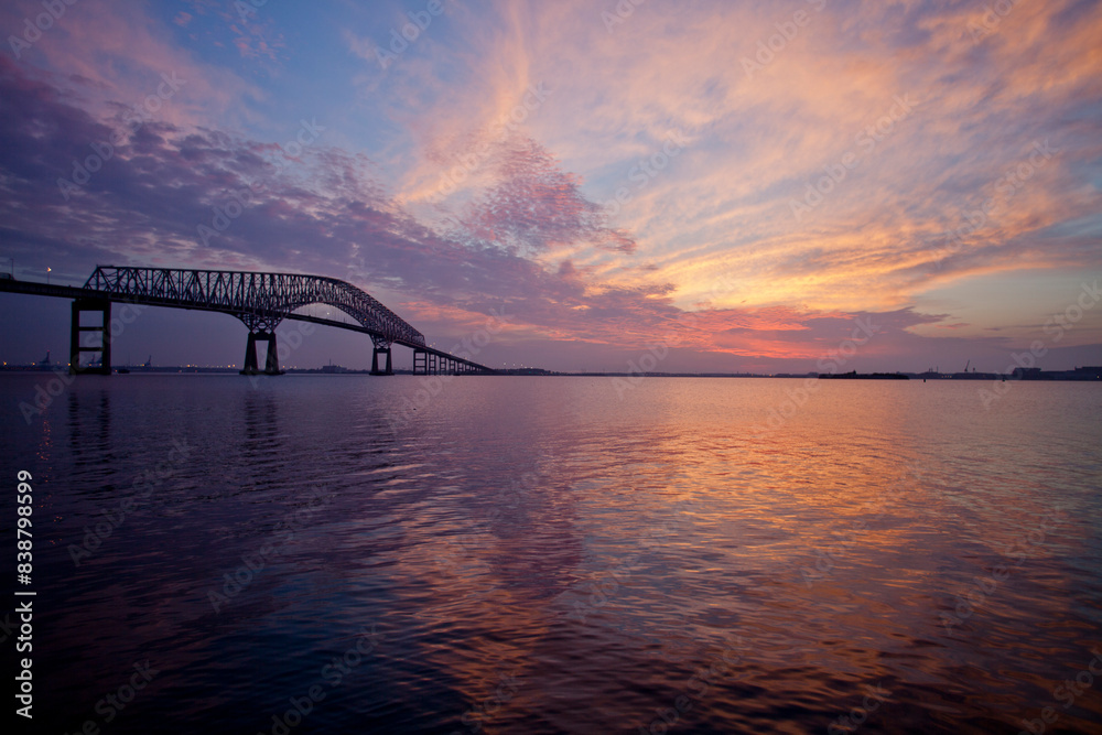 Naklejka premium Sunrise over the Francis Scott Key Bridge spanning the Baltimore Inner Harbor of the Chesapeake Bay.