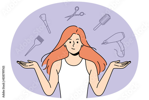 Woman stylist with flying accessories for hairdresser offers to make new hairstyle to change image. Girl hairdresser from beauty salon recommends taking care of hair and using professional equipment
