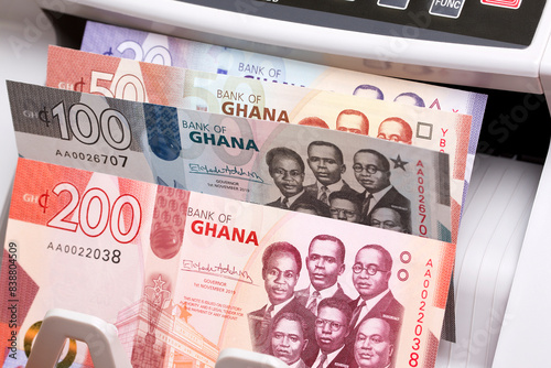 Quadro su tela Ghanaian cedi in a counting machine